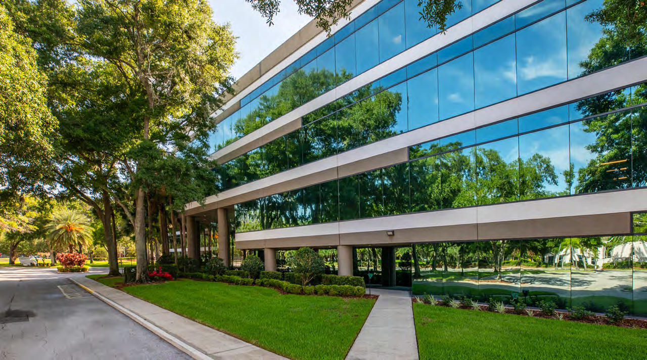 Research Pavilion exterior — glass facade and Central Florida landscaping